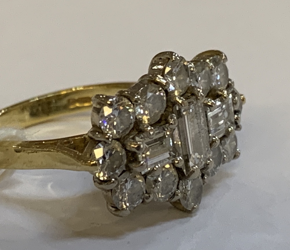 An 18ct yellow gold and diamond cluster ring, centred with three baguette cut stones within a border - Image 2 of 4