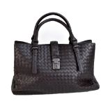 BOTTEGA VENETA; a ROMA dark brown braided calf skin handbag, with small front brass closure, and