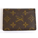 LOUIS VUITTON; a Monogram canvas pocket organiser lined with beige Taiga leather with outside