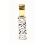 An 18ct yellow gold and white gold three stone diamond pendant with total diamond weight approx 0.
