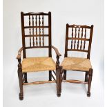 A set of six Macclesfield ash framed spindle back dining chairs with rush seats on turned and