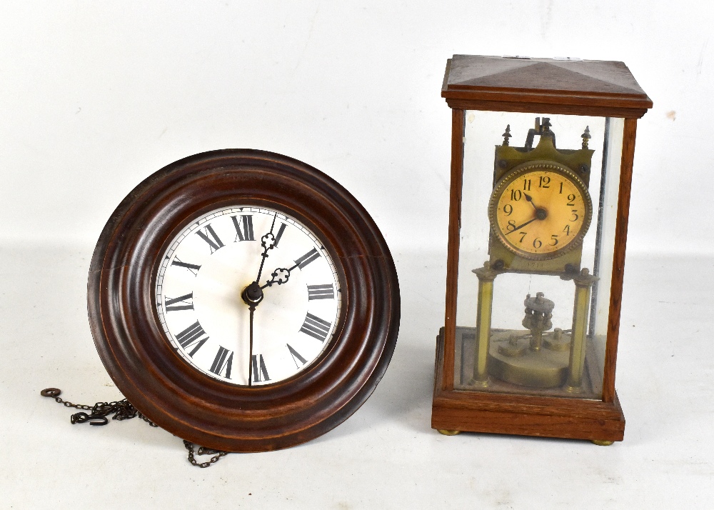 An oak cased electric mantel clock, the circular face set with Arabic numerals, height 28cm,
