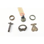 A group of antiquities including a Medieval bronze finger ring, a Medieval silver belt clip, and