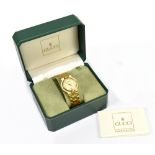 GUCCI; a gold plated wristwatch with circular dial and date aperture, sold with spare additional