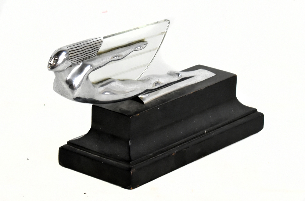 An Art Deco 'Flying Goddess' chrome car mascot, originally from a 1937 Cadillac, raised on later