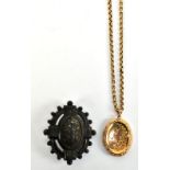 A 9ct yellow gold chain suspending and engraved oval locket, combined approx 13.6g and a Victorian