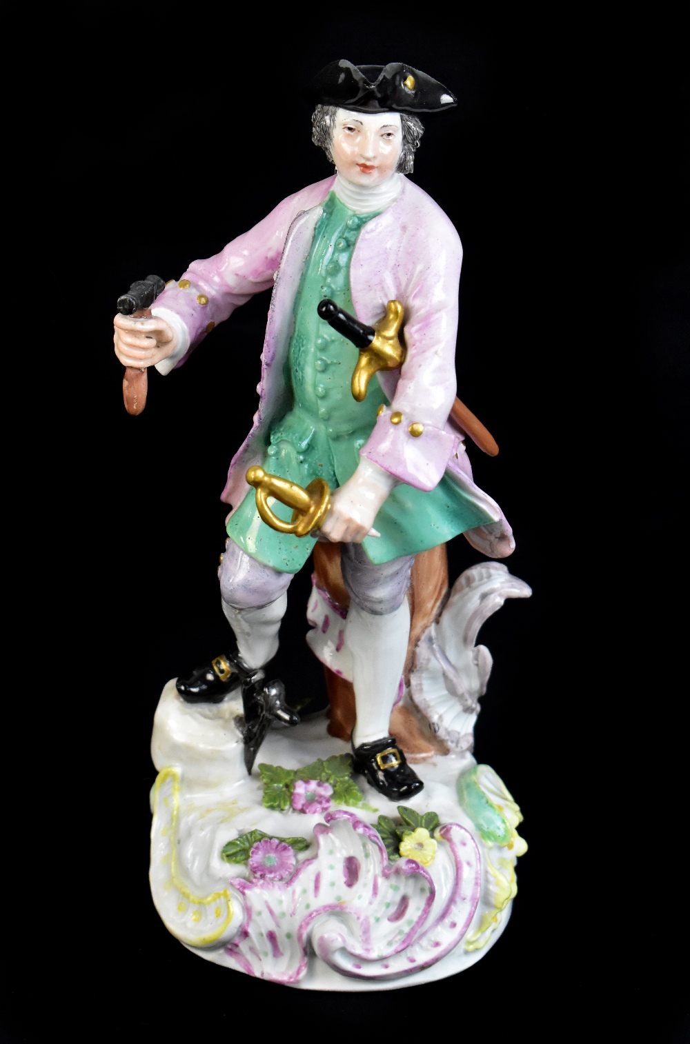 MEISSEN; a mid-18th century figure of a sword maker, painted marks to back of base, height 23cm.