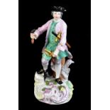 MEISSEN; a mid-18th century figure of a sword maker, painted marks to back of base, height 23cm.