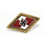 A German Third Reich Hitler Youth gilt metal and enamelled lozenge shaped leader's badge, stamped '