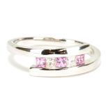An 18ct white gold pink sapphire and diamond five stone ring, size N, approx 3.6g.
