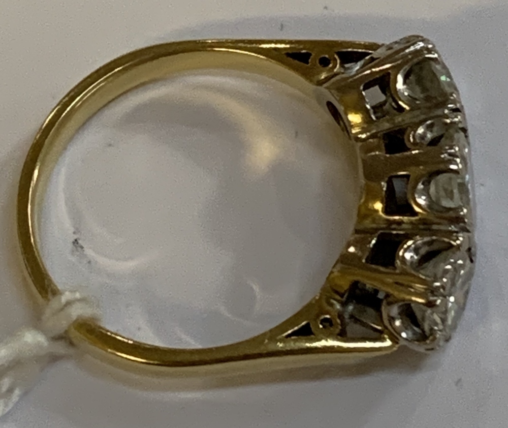 An 18ct yellow gold and diamond three stone ring, the central round brilliant cut stone weighing - Image 5 of 8