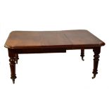 A Victorian mahogany wind out extending dining table with one extra leaf, length 162cm (af).
