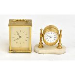 A gilt metal and alabaster time piece, the white enamel dial set with Roman numerals, height 11cm,