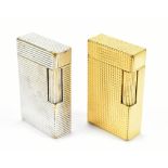 DUPONT; a white metal rectangular table lighter and a matching yellow metal example (2).Additional