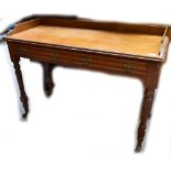 A late Victorian walnut two drawer side table raised on turned and block legs to castors, width