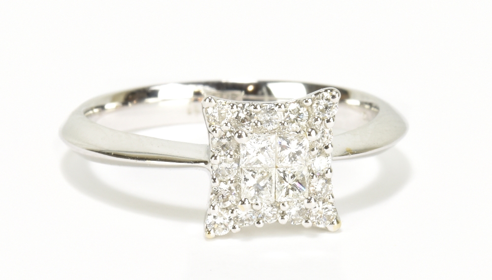 An 18ct white gold diamond ring with stepped platform set with twenty diamonds totalling approx 0.