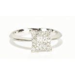 An 18ct white gold diamond ring with stepped platform set with twenty diamonds totalling approx 0.
