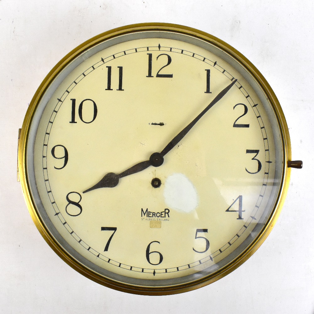 MERCER; a brass cased ship's wall clock, the dial set with Arabic numerals, diameter 37cm.Additional
