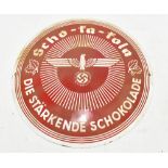 A Third Reich circular enamelled advertising sign for Scho-Ka Kola chocolate with motto 'Die