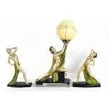 An Art Deco painted plaster figural table lamp modelled as a scantily clad lady supporting a