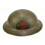 A WWII Combined Services Brodie-type helmet with painted decal and leather liner, length 30.8cm.