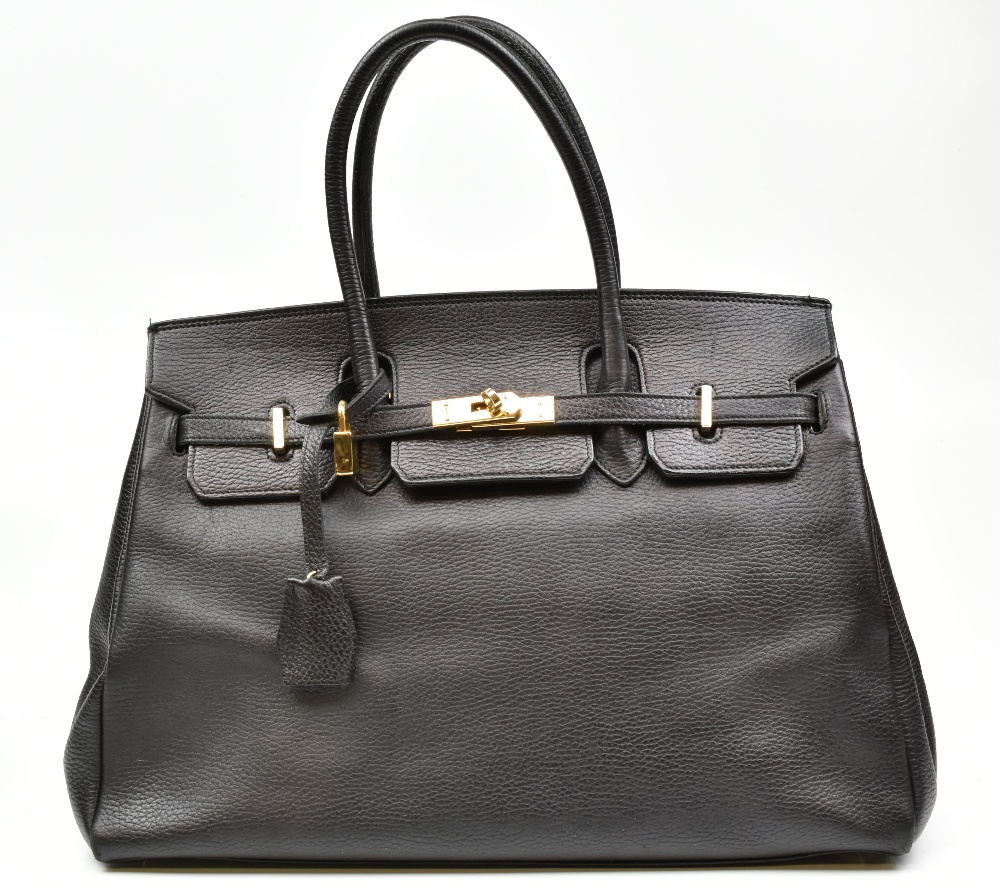 COCSI, ITALY; a black grained leather 'Birkin' handbag with gold hardware including padlock and key,