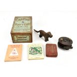 A mixed group of collectors' items comprising a patent bronze dog nutcracker, a wooden fly reel, two
