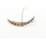 A 15ct yellow gold sapphire and diamond crescent brooch, length 4.8cm, approx 3.5g.Additional