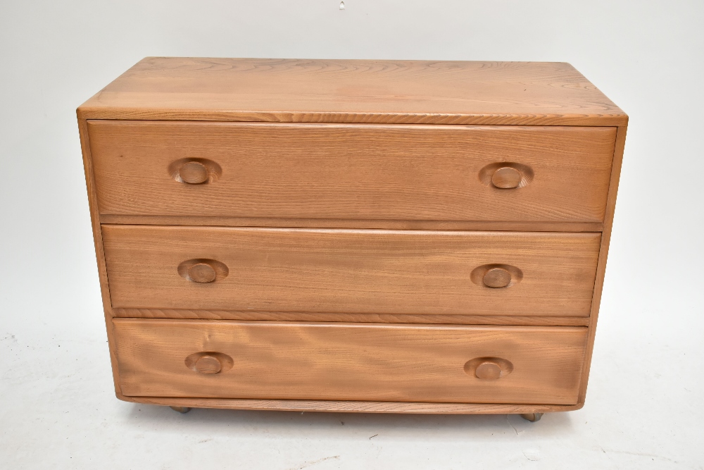 ERCOL; a light elm three drawer chest of drawers, width 91cm.