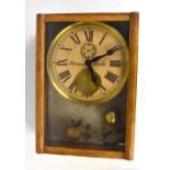 BRILLIE; an oak cased electric wall clock, the circular dial set with Roman numerals and two