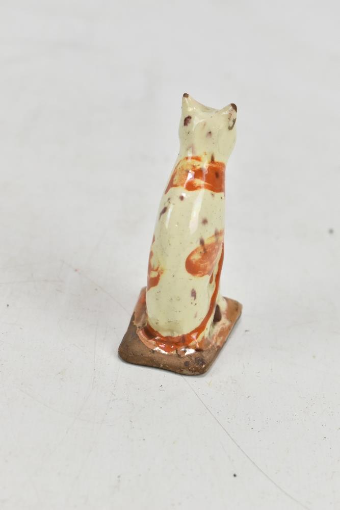 An early 19th century Bovey Tracey cream glazed model of a seated cat, height 8.7cm.Additional - Image 3 of 4