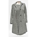 AKRIS; a black and white tweed shift dress and full length coat, (size US 12) (2).
