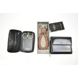 FURLA; a black leather purse, 10cm x 9cm x 3cm, a black leather dupont, Paris leather key fob and