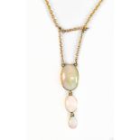 A 9ct yellow gold graduated three stone opal necklace, length 41cm, approx 4.8g.