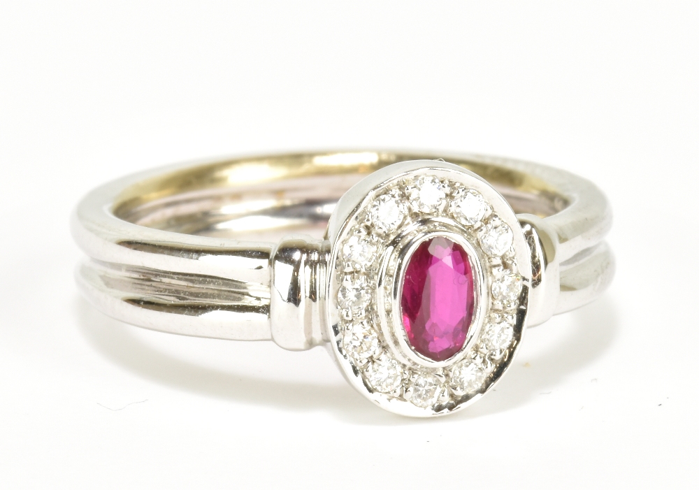 An 18ct white gold ruby and diamond ring, size M, approx 5.3g.