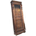 A large Continental carved walnut glazed bookcase.Additional InformationHeight 263cm, depth 32cm,