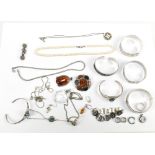 A quantity of predominantly silver jewellery including a snap bangle, various other bangles, a