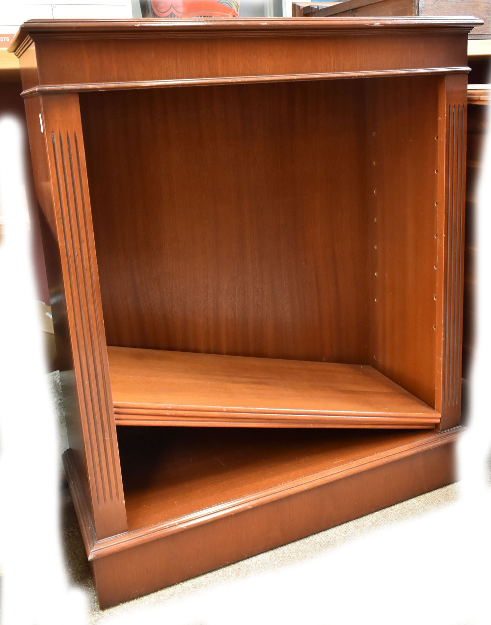 A reproduction mahogany open bookcase.