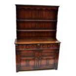 TITCHMARSH & GOODWIN; a reproduction oak dresser with boarded plate rack and base of two drawers