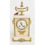A 19th century alabaster mantel clock with gilt metal mounts and urn finial, the circular painted