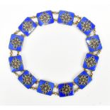 A Norwegian sterling silver blue enamel filigree decorated necklace formed of twelve rectangular