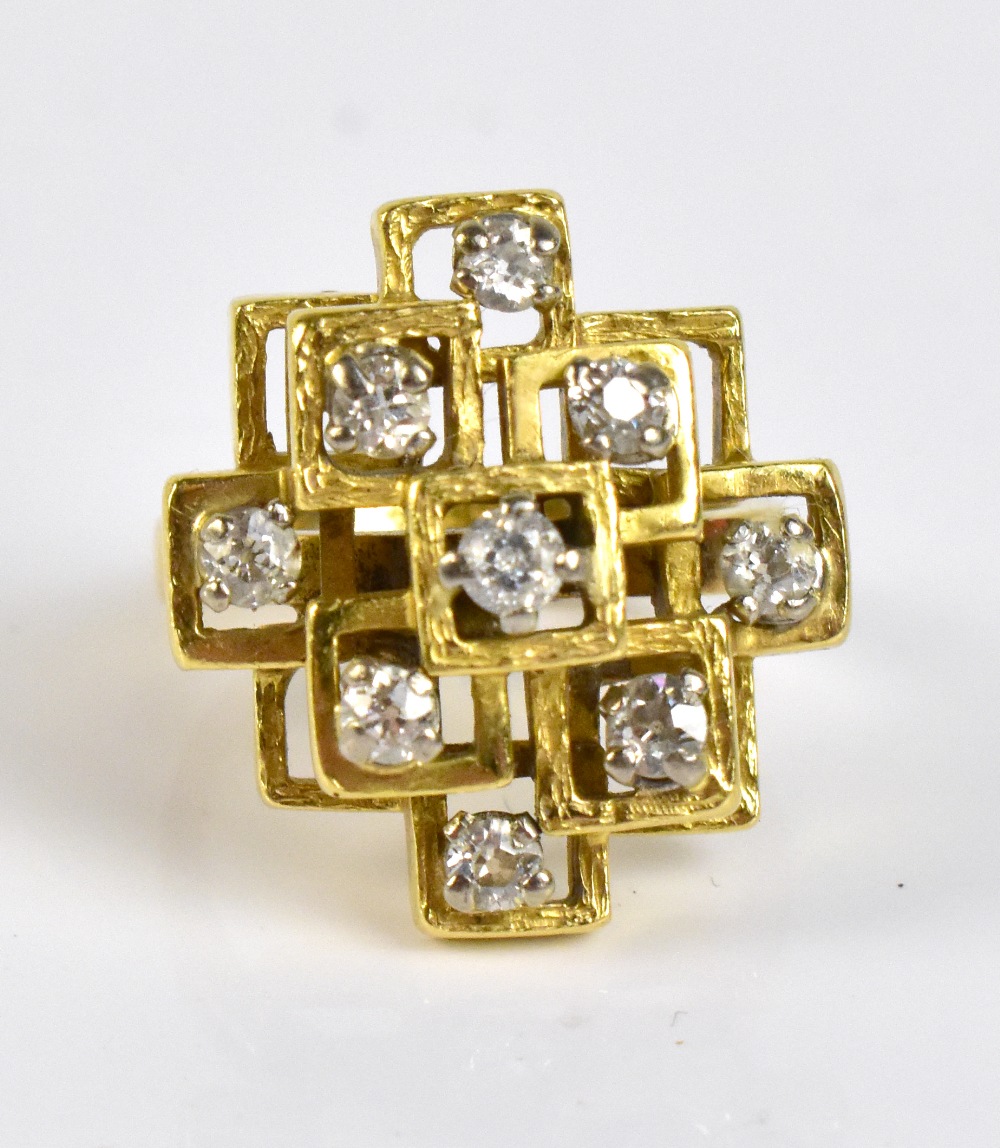 An 18ct yellow gold and diamond set ring of abstract stepped design, with nine round brilliant cut