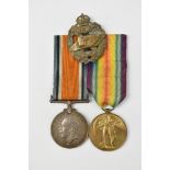 A WWI medal duo awarded to 201870 Pte. W. Tiley Tank Corps with Tank Corps cap badge.