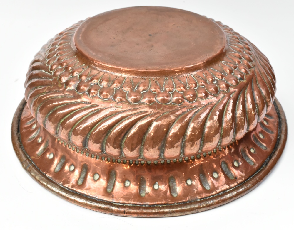 A large Eastern embossed copper bowl, diameter approx 39cm. - Bild 2 aus 2