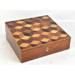 An early 19th century cube parquetry inlaid writing slope, the interior set with inkwells, a leather