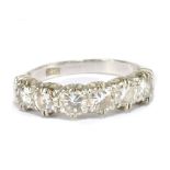 An 18ct white gold and six stone diamond ring, the diamonds totalling approx 1.25ct, size Q,