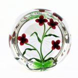 WILLIAM MANSON; a limited edition glass paperweight, encased with floral sprays, 1/15, signed to