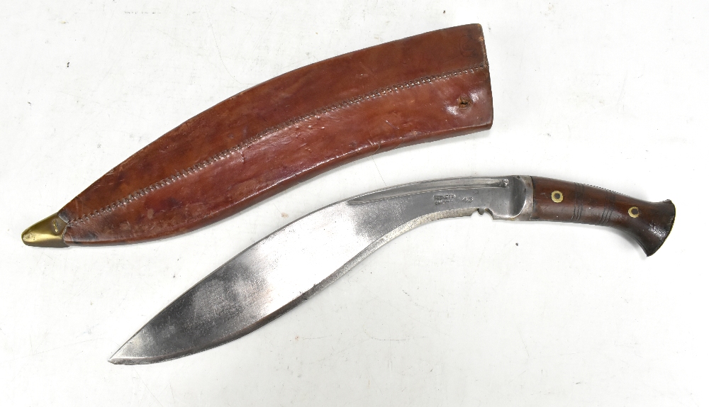 A kukri stamped 'Pioneer Calcutta 43' to blade with wooden hilt, length approx 44cm, in possibly