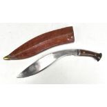 A kukri stamped 'Pioneer Calcutta 43' to blade with wooden hilt, length approx 44cm, in possibly