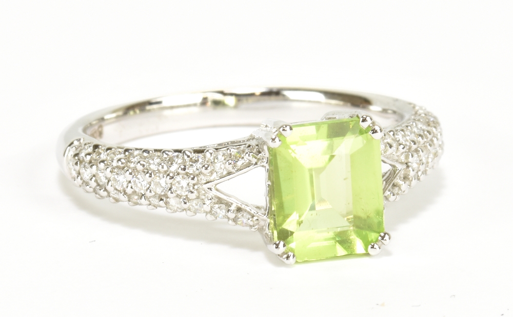 An 18ct white gold green peridot and diamond dress ring, size L, approx 2.8g.